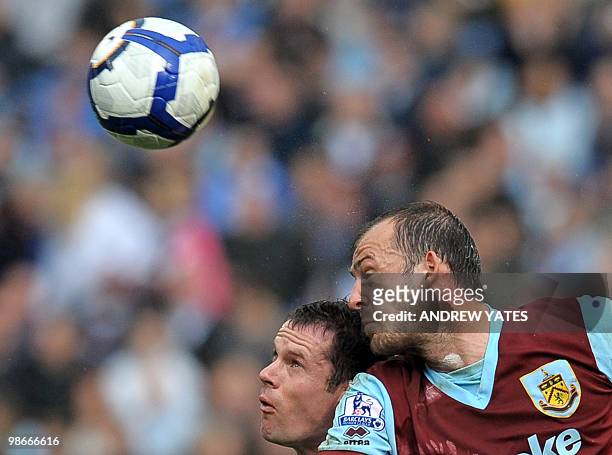 Burnley's Scottish forward Steven Fletcher vies with Liverpool's English defender Jamie Carragher during the English Premier League football match...