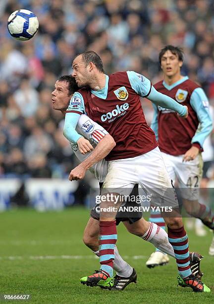 Burnley's Scottish forward Steven Fletcher vies with Liverpool's English defender Jamie Carragher during the English Premier League football match...