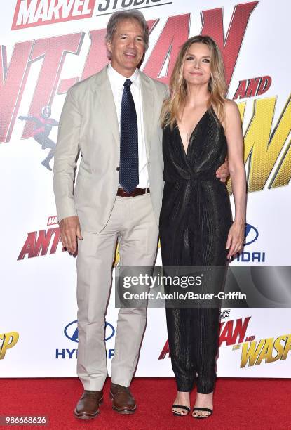 Actress Michelle Pfeiffer and husband David E. Kelley attend the premiere of Disney and Marvel's 'Ant-Man and the Wasp' at El Capitan Theatre on June...