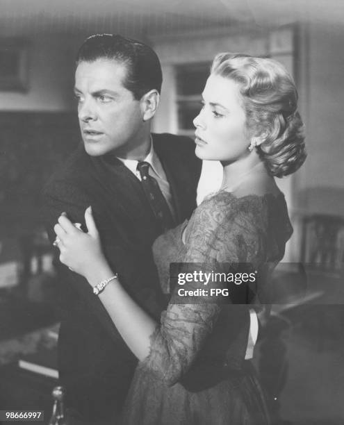 Grace Kelly as Margot Mary Wendice and Robert Cummings as Mark Halliday in a scene from the thriller 'Dial M For Murder', directed by Alfred...