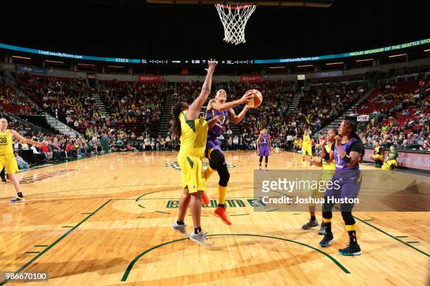 Candace Parker of the Los Angeles Sparks goes to the basket against the Seattle Storm on June 28, 2018 at Key Arena in Seattle, Washington. NOTE TO...