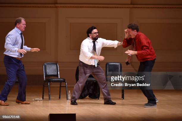Ian Roberts, Horatio Sanz and Matt Besser perform onstage during ASSSSCAT with the Upright Citizens Brigade Live at Carnegie Hall celebrating the...