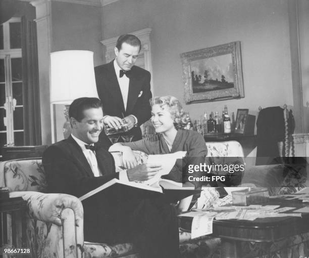 Robert Cummings , Ray Milland and Grace Kelly in a scene from the thriller 'Dial M For Murder', directed by Alfred Hitchcock, 1954.