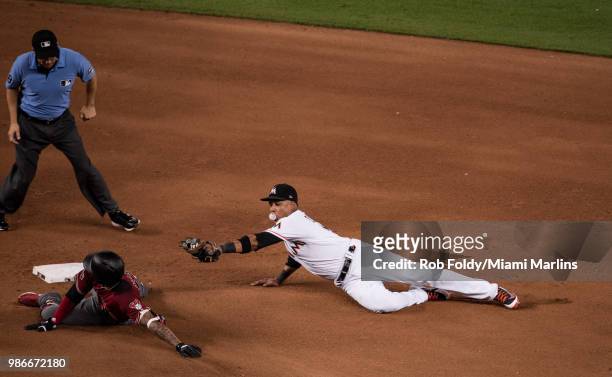 Ketel Marte of the Arizona Diamondbacks slides into second base past Starlin Castro of the Miami Marlins during the game at Marlins Park on June 27,...