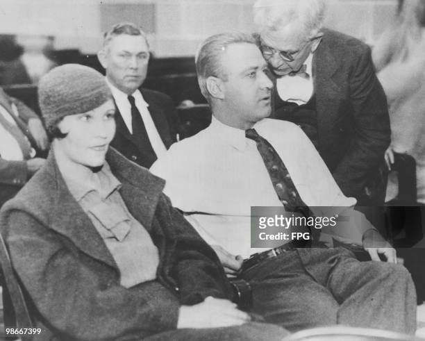 Attorney, James H. Mathers whispers to his client, American gangster George Kelly Barnes , aka Machine Gun Kelly, at his trial for the kidnapping of...