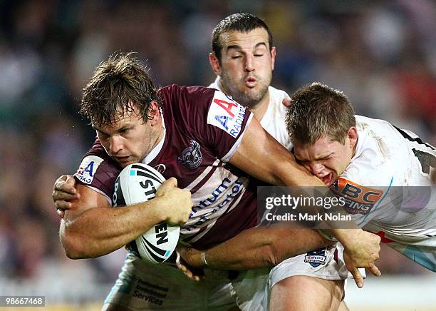 Josh Perry of the Eagles is tackled during the round seven NRL match between the Manly Sea Eagles and the Gold Coast Titans at Brookvale Oval on...