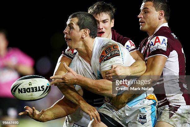 Greg Bird of the Titans offloads during the round seven NRL match between the Manly Sea Eagles and the Gold Coast Titans at Brookvale Oval on April...