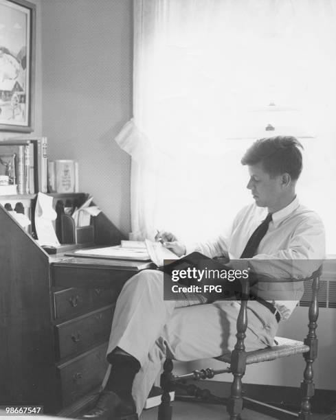 United States Senator from Massachusetts John F. Kennedy in his study, circa 1955.