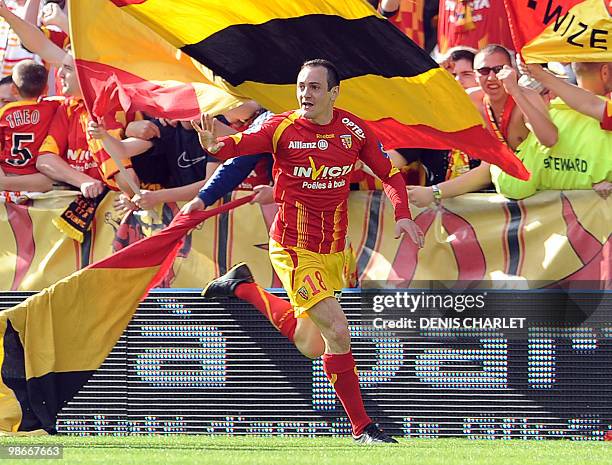 Lens's French forward Kevin Monnet-Paquet celebrates after scoring during the French L1 football match Lens vs. Valenciennes on April 25, 2010 at the...