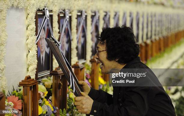 Mother of late South Korean sailor Kim Tae-Suck mourns at a portrait of her son during a memorial service at the Second Fleet Command of Navy on...