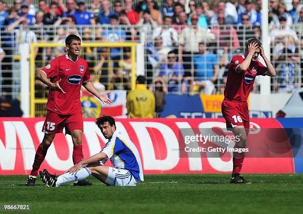 Tim Goehlert of 1. FC Heidenheim and Florian Krebs of 1. FC Heidenheim reacts - Sebastian Haehnge of FC Carl Zeiss Jena during the Third League match...