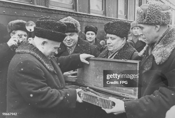 Soviet Premier Nikita Khrushchev is presented with a shotgun during a visit to an arms factory in Tula, Russia, 1959.