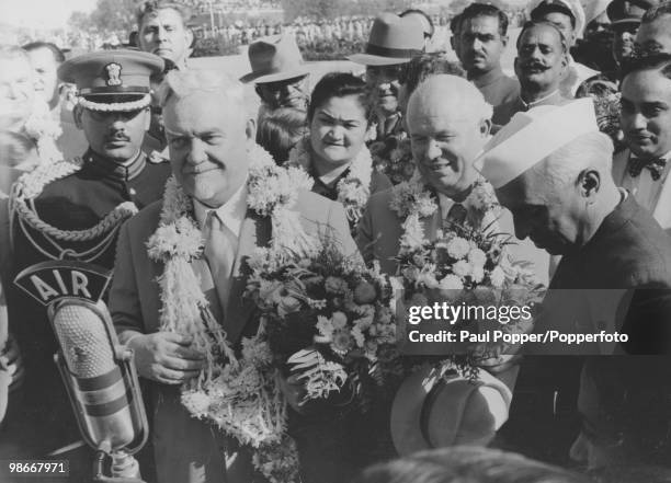 Soviet Premier Nikolai Bulganin with Soviet Communist Party First Secretary Nikita Khrushchev and Indian Prime Minister Jawaharlal Nehru at Palam...