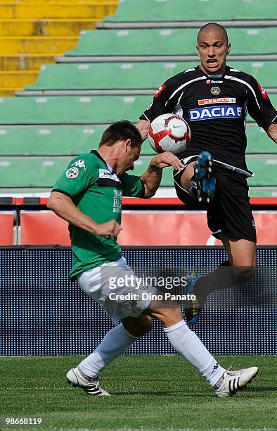 Alexandros Tziolis of Siena battles for the ball with Gokhan Inler oif Udinese during the Serie A match between Udinese Calcio and AC Siena at Stadio...