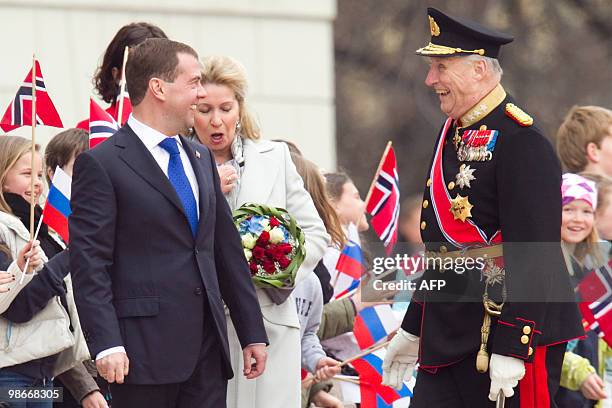 Russian President Dmitry Medvedev and his wife Svetlana Medvedeva are welcome by Norwegian King Harald , as Norwegian school children wave national...