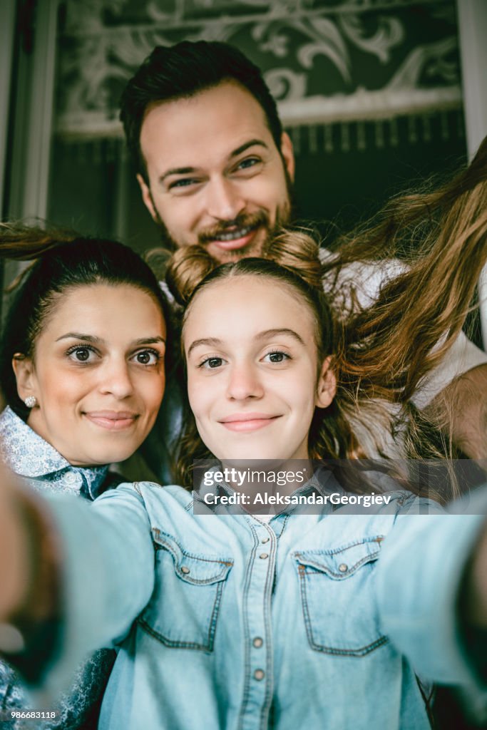 Selfie Portrait Of Happy Family Having Fun At Home