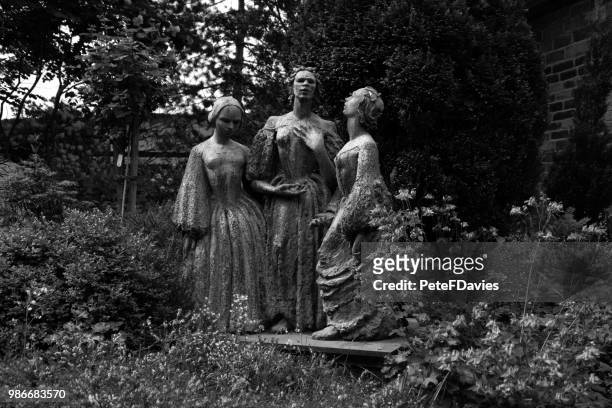 statue of three ladies. - charlotte brontë stock pictures, royalty-free photos & images
