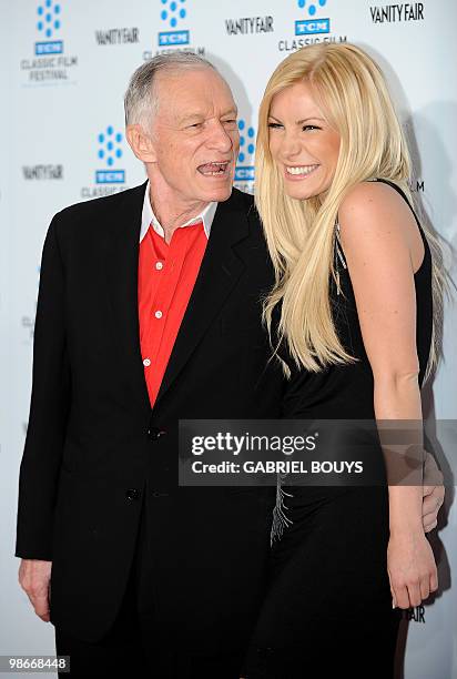 Playboy owner Hugh Hefner arrives with Playmate and actress Crystal Harris at the world premiere of the restored "A Star is born" during the opening...