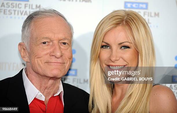 Playboy owner Hugh Hefner arrives with Playmate and actress Crystal Harris at the world premiere of the restored "A Star is born" during the opening...