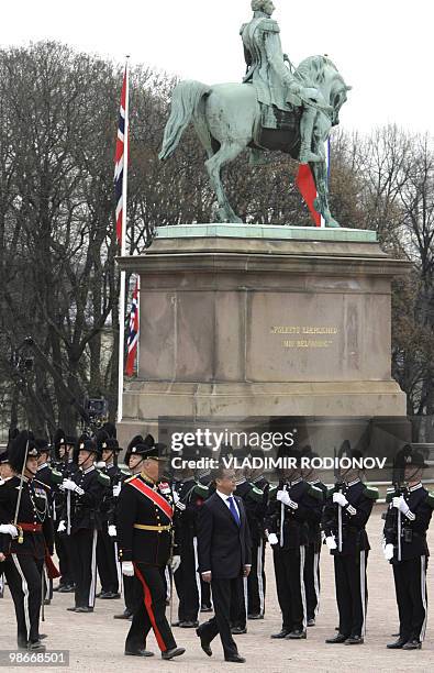 Russian President Dmitry Medvedev walks with Norwegian King Harald outside the Norwegian Royal Palace in Oslo on April 26, 2010. Medvedev arrived in...