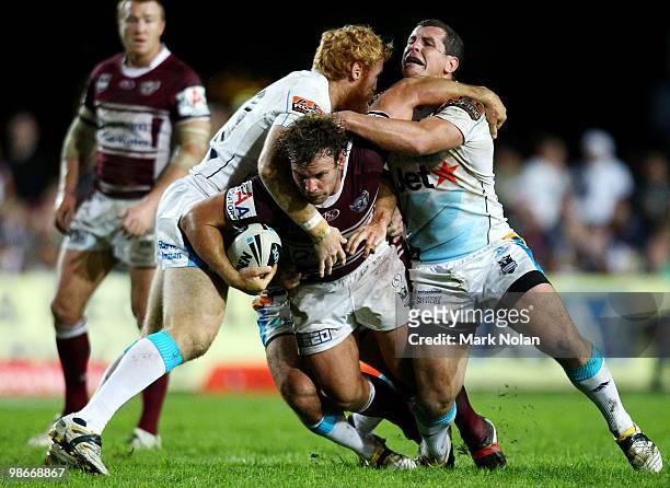 Josh Perry of the Eagles is tackled during the round seven NRL match between the Manly Sea Eagles and the Gold Coast Titans at Brookvale Oval on...