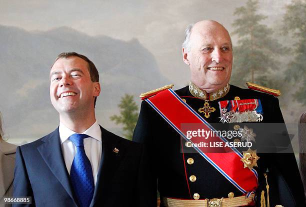 Norwegian King Harald and Russian President Dmitry Medvedev pose for a photography during a welcome ceremony upon Medvedev's arrival at the Norwegian...