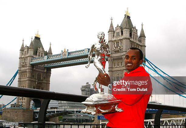 Winner of Men's race Tsegaye Kebede poses with the trophy during the 2010 Virgin London Marathon winners photocal at The Tower Hotel on April 26,...