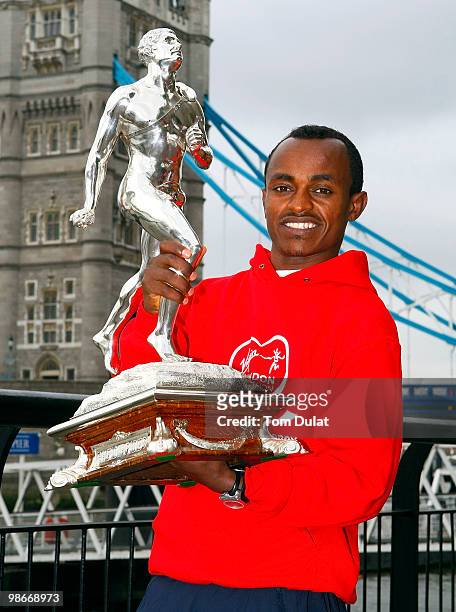 Winner of Men's race Tsegaye Kebede poses with the trophy during the 2010 Virgin London Marathon winners photocal at The Tower Hotel on April 26,...