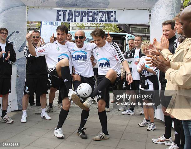 The dribblers that particiate the charity-run: actor Buelent Sharif, singer Peyman Amin and actor Roman Knizka pose for the press on April 26, 2010...