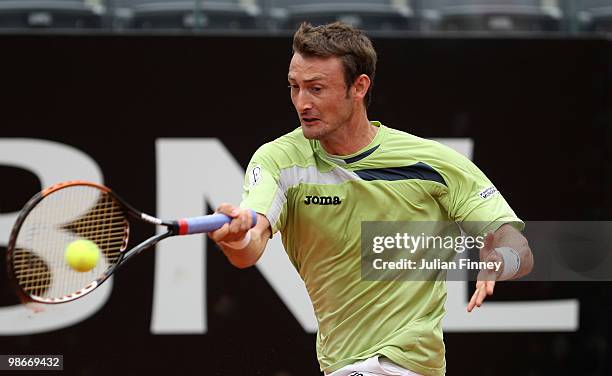 Juan Carlos Ferrero of Spain plays a forehand in his match against Santiago Giraldo of Colombia during day two of the ATP Masters Series - Rome at...