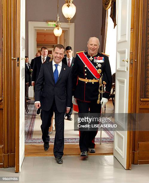 Norwegian King Harald and Russian President Dmitry Medvedev walk during a welcome ceremony upon Medvedev's arrival at the Norwegian Royal Palace in...