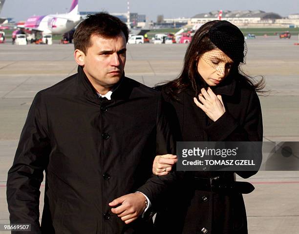 Late Polish President Lech Kaczynski's daughter Marta and her husband Marcin Dubieniecki leave Warsaw airport after the coffins of Lech Kaczynski and...
