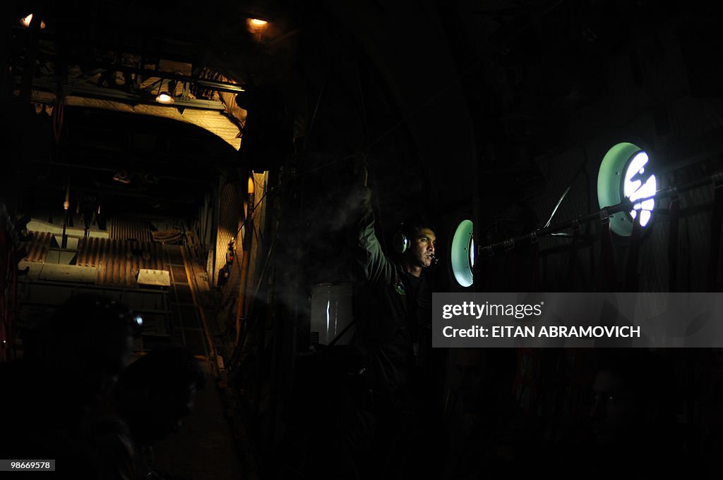 A Colombian air force soldier peers thro