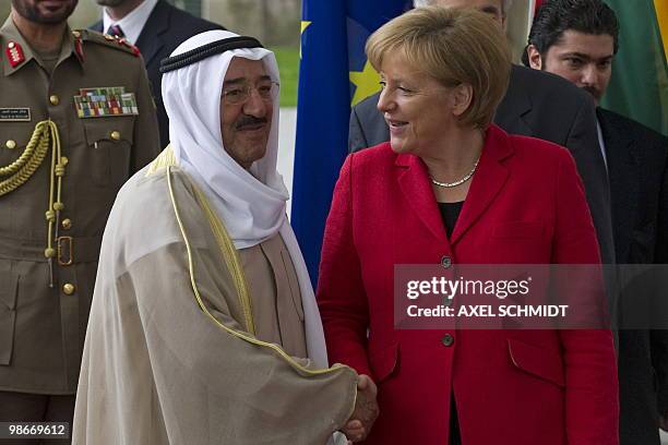 German Chancellor Angela Merkel welcomes Sheikh Sabah Al-Ahmad Al-Jaber Al-Sabah, Emir of Kuwait, on April 26, 2010 at the Chancellery in Berlin. AFP...