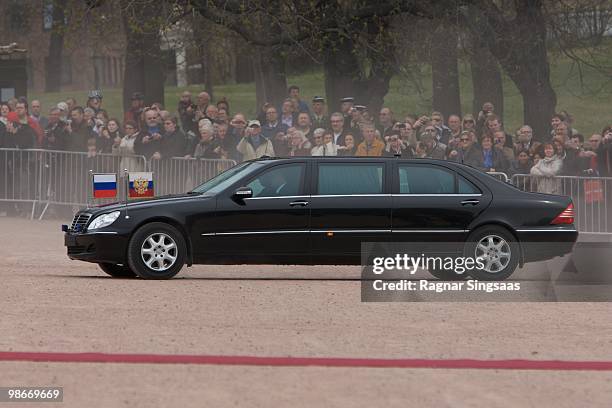 Russian President Dmitry Medvedev and Mrs Svetlana Medvedeva arrive in their limousine at the Royal Palace on April 26, 2010 in Oslo, Norway....