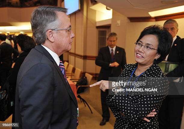 Australia's Treasurer Wayne Swan chats with Indonesian Finance Minister Mulyani Indrawati before the start of the G-20 Finance Ministers and Central...