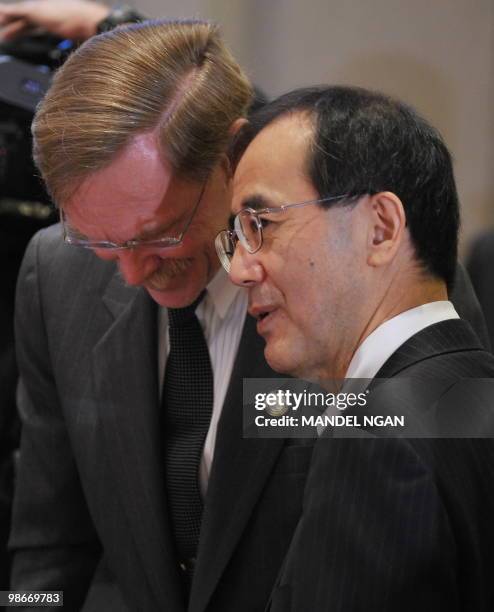 Bank of Japan Governor Masaaki Shirakawa chats with World Bank President Robert Zoellick before the start of the G-20 Finance Ministers and Central...