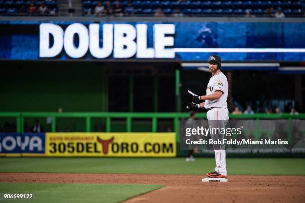 Dan Straily of the Miami Marlins reacts after hitting a double during the game against the Arizona Diamondbacks at Marlins Park on June 25, 2018 in...