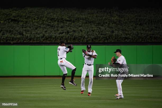 Cameron Maybin, Lewis Brinson and Brian Anderson of the Miami Marlins celebrate after the game against the Arizona Diamondbacks at Marlins Park on...