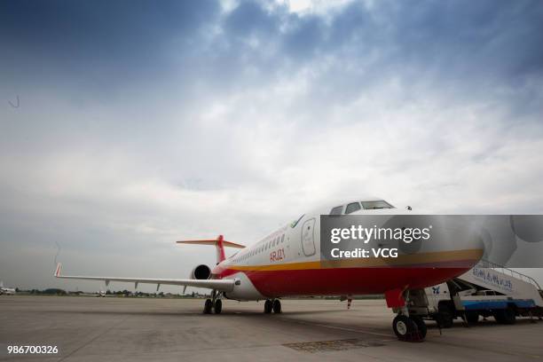 Domestic-made ARJ21 'Xiangfeng' sits on the tarmac at Yangzhou Taizhou International Airport before its month-long test flight on June 27, 2018 in...