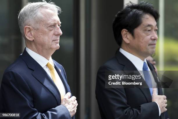 James Mattis, U.S. Secretary of defense, left, and Itsunori Onodera, Japan's defense minister, observe an honor guard ahead of their meeting at the...