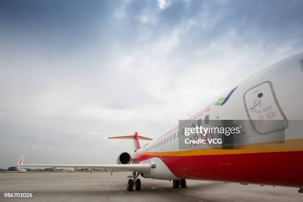 Domestic-made ARJ21 'Xiangfeng' sits on the tarmac at Yangzhou Taizhou International Airport before its month-long test flight on June 27, 2018 in...