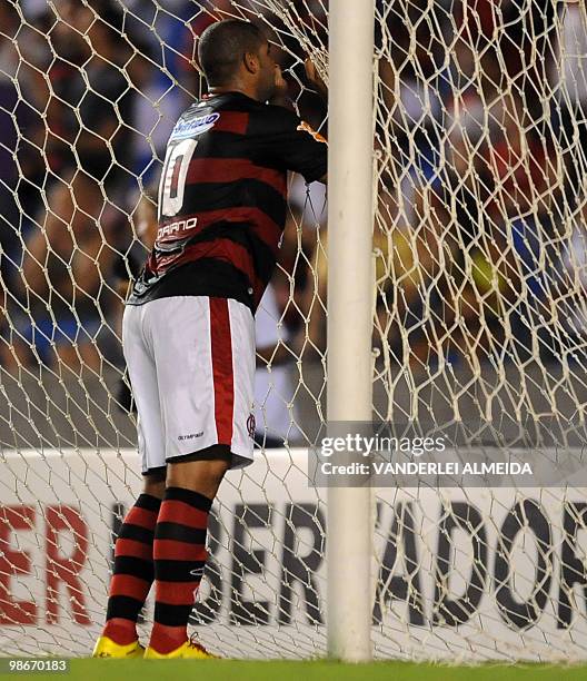 Flamengo's player Adriano reacts after missing a goal against Caracas during their Libertadores Cup football match at Maracana stadium in Rio de...