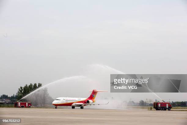 Domestic-made ARJ21 'Xiangfeng' sits on the tarmac at Yangzhou Taizhou International Airport before its month-long test flight on June 27, 2018 in...