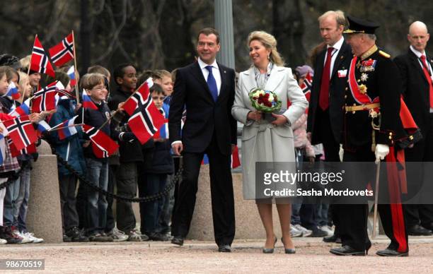 Russian President Dmitry Medvedev, his wife Svetlana and King Harald V of Norway attends the official welcome ceremony for the Medevedevs outside the...