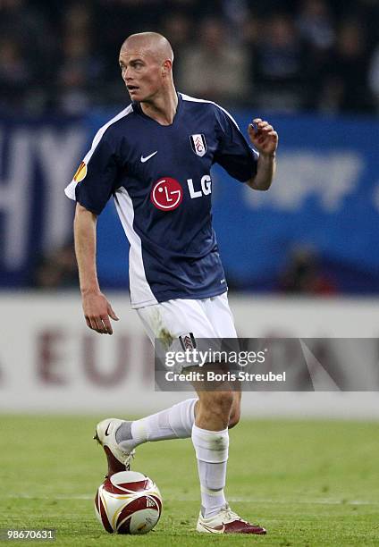 Paul Konchesky of Fulham runs with the ball during the UEFA Europa League semi final first leg match between Hamburger SV and Fulham at HSH Nordbank...