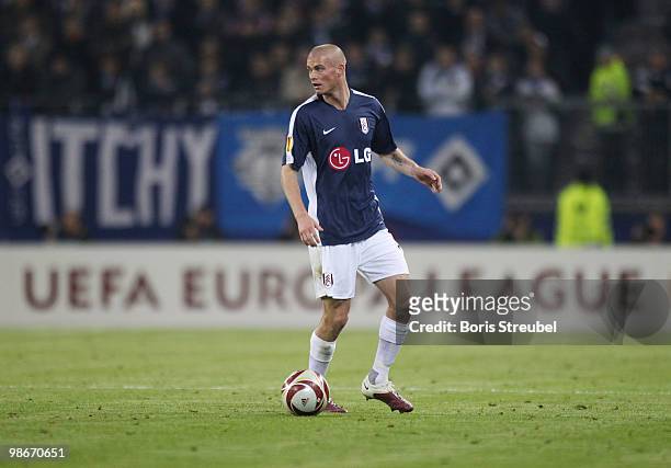 Paul Konchesky of Fulham runs with the ball during the UEFA Europa League semi final first leg match between Hamburger SV and Fulham at HSH Nordbank...