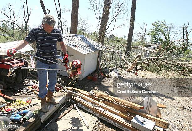 Danny Gordon, retrieves lawn equipment from his home on April 25, 2010 in Yazoo City, Mississippi. On Saturday a massive tonado hit the Mississippi...
