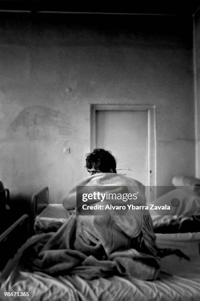 Saigedullah, a drug addict, sits wrapped in a blanket in Kabul's psychiatric hospital. In the capital, there is only one centre with a 4-bed capacity...