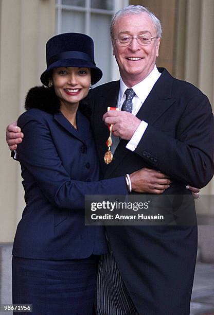 Michael Caine and his wife Shakira Caine pose after he received his Knighthood from the Queen at Buckingham Palace on November 16, 2000 in London,...